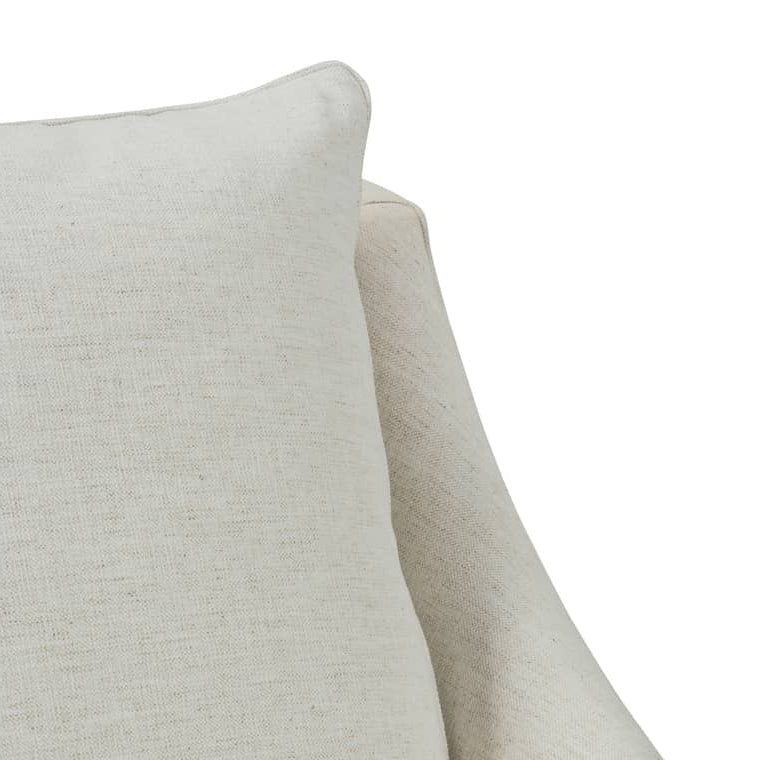 Close-up of a light beige textured fabric cushion or upholstered furniture corner on a plain white background.