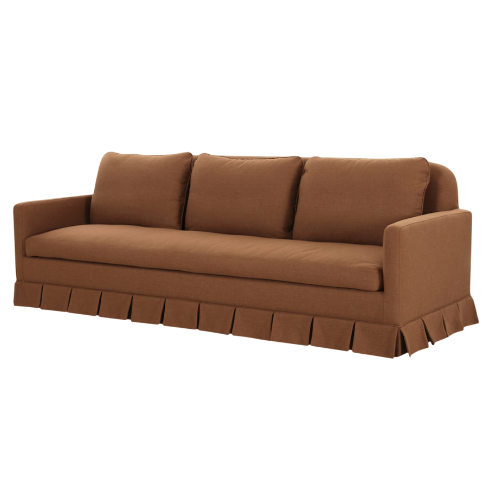 Brown sofa with a pleated skirt on a white background